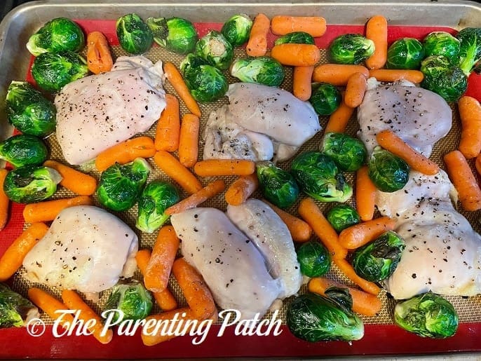Partially Cooked Maple-Roasted Pecan Chicken with Carrots and Brussels Sprouts Sheet Pan Meal 