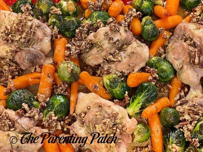 Cooked Maple-Roasted Pecan Chicken with Carrots and Brussels Sprouts Sheet Pan Meal 