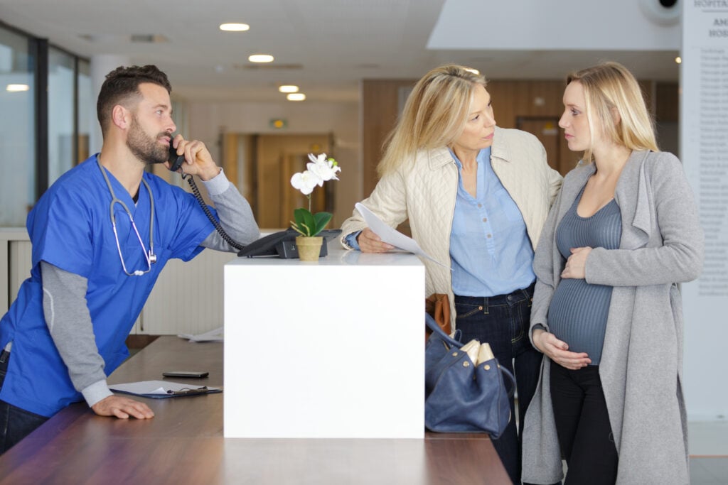 pregnant woman arriving at clinic