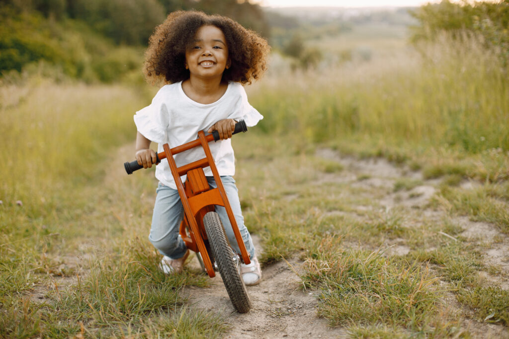 Kid playing on her bike