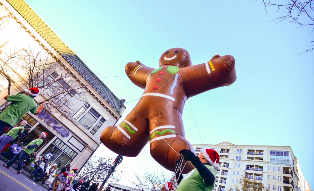 ginger bread cookie inflatable floating thru city streets