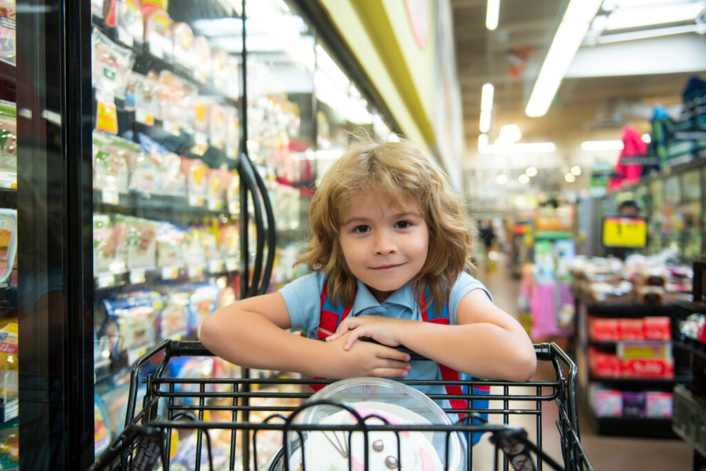 Child in grocery store for food