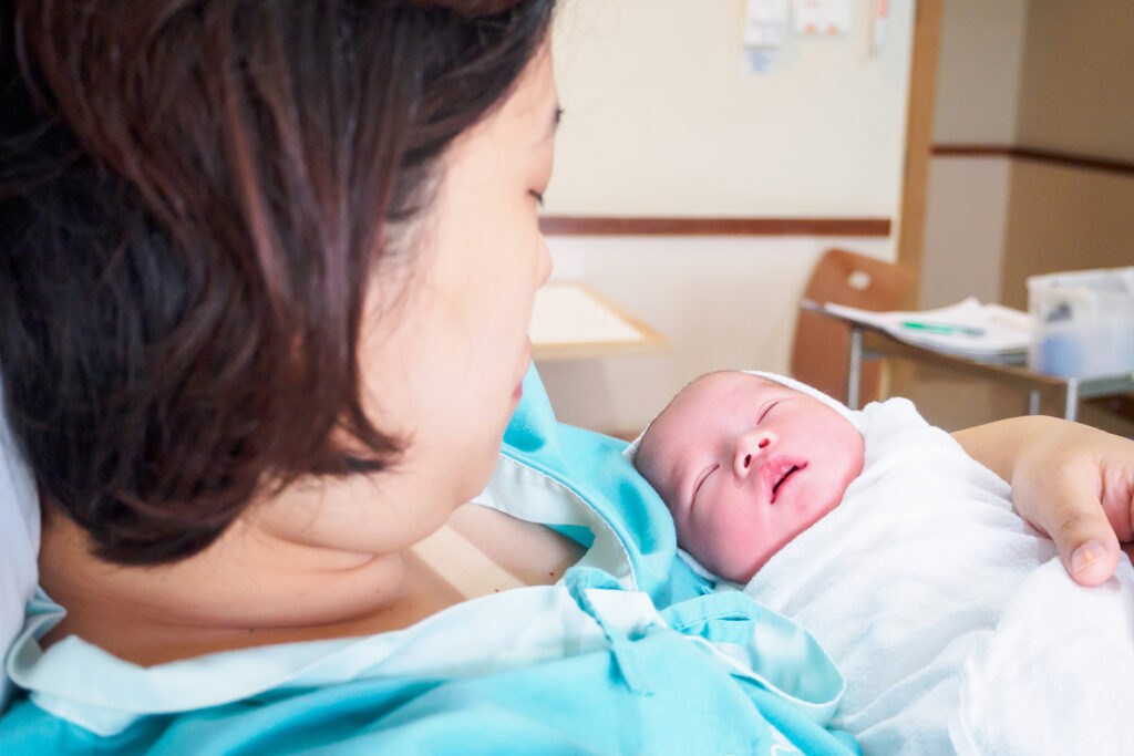 Happy Mother and Newborn Baby after labor at the hospital