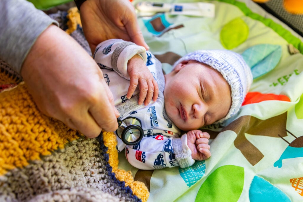 Newborn being checked out at hospital