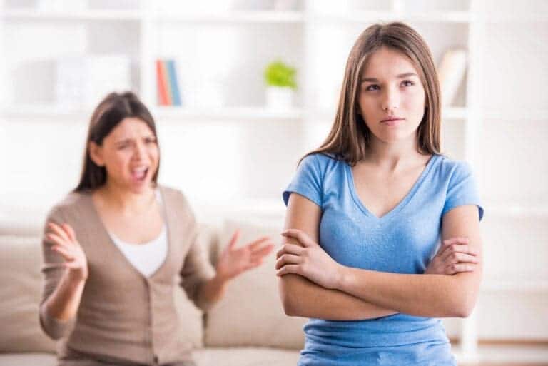 Mother scolding annoyed teen daughter
