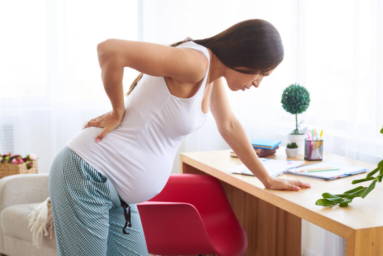 Young pregnant woman suffering from backache
