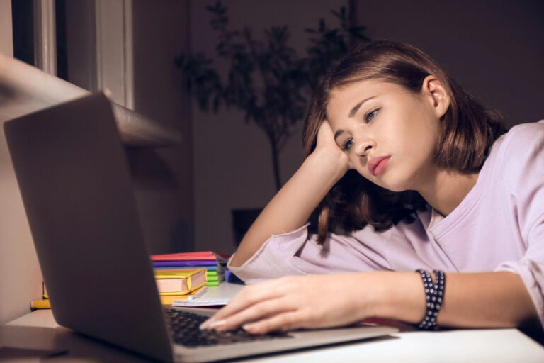 Teen uses computer in the dark