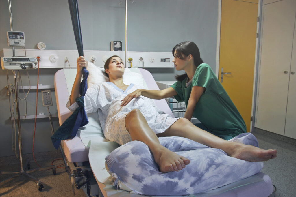 Pregnant woman in a hospital with a gynecologist