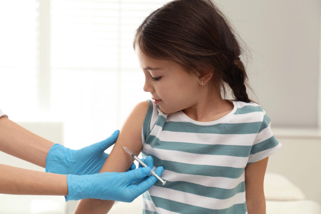 Child receiving protective vaccine